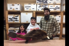 big-brother-showing-kids-a-fur